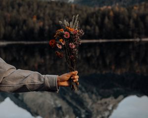 Preview wallpaper bouquet, flowers, hand, landscape, reflection