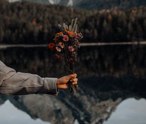 Preview wallpaper bouquet, flowers, hand, landscape, reflection