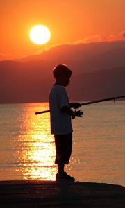 Preview wallpaper boy, river, lake, fishing, fishing rod, sunset, hills