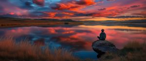 Preview wallpaper boy, silhouette, lake, stone, sky, alone