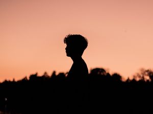 Preview wallpaper boy, silhouette, sunset, loneliness, water