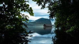 Preview wallpaper branches, lake, house, mountains, reflection