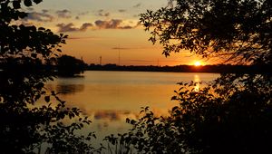 Preview wallpaper branches, sun, sunset, lake, sky