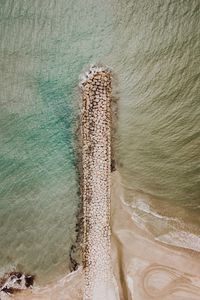 Preview wallpaper breakwater, aerial view, sea, stones, beach, sand