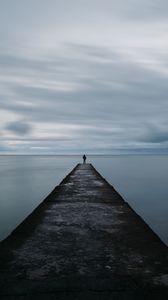 Preview wallpaper breakwater, pier, man, sea, loneliness