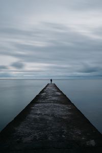Preview wallpaper breakwater, pier, man, sea, loneliness