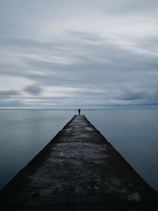 Preview wallpaper breakwater, pier, man, sea, loneliness