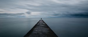 Preview wallpaper breakwater, pier, man, sea, loneliness