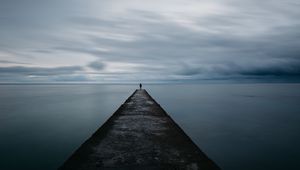 Preview wallpaper breakwater, pier, man, sea, loneliness