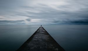 Preview wallpaper breakwater, pier, man, sea, loneliness