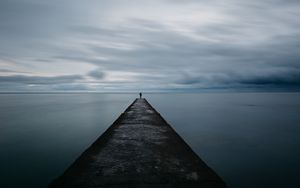 Preview wallpaper breakwater, pier, man, sea, loneliness