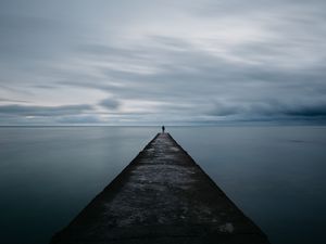 Preview wallpaper breakwater, pier, man, sea, loneliness