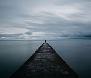 Preview wallpaper breakwater, pier, man, sea, loneliness