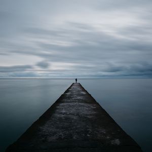 Preview wallpaper breakwater, pier, man, sea, loneliness