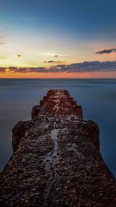 Preview wallpaper breakwater, sea, skyline, sunset