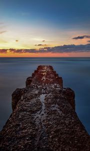 Preview wallpaper breakwater, sea, skyline, sunset