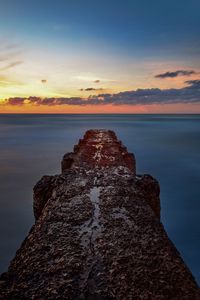 Preview wallpaper breakwater, sea, skyline, sunset