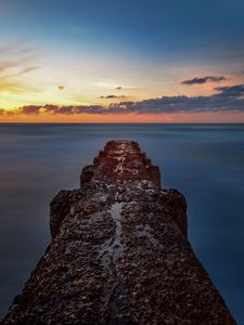Preview wallpaper breakwater, sea, skyline, sunset