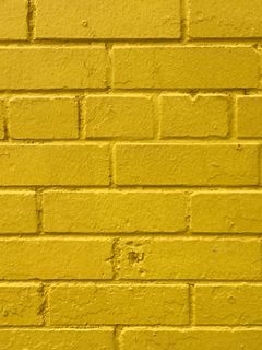 240x320 Wallpaper bricks, yellow, wall, texture