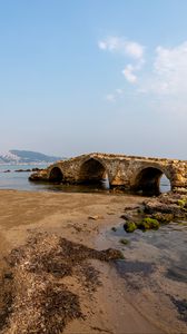 Preview wallpaper bridge, arches, ruins, shore, sea