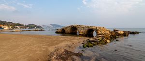 Preview wallpaper bridge, arches, ruins, shore, sea