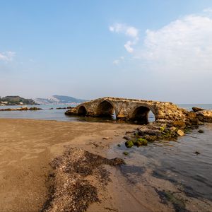 Preview wallpaper bridge, arches, ruins, shore, sea