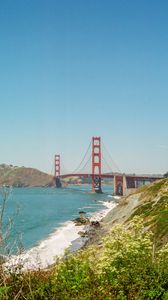 Preview wallpaper bridge, architecture, rocks, sea, bushes