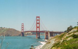 Preview wallpaper bridge, architecture, rocks, sea, bushes