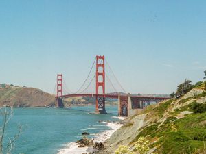 Preview wallpaper bridge, architecture, rocks, sea, bushes