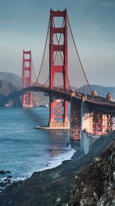 Preview wallpaper bridge, architecture, sea, rocks, water