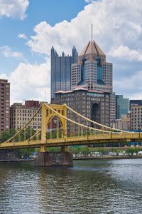 Preview wallpaper bridge, buildings, architecture, river, city, clouds