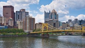 Preview wallpaper bridge, buildings, architecture, river, city, clouds