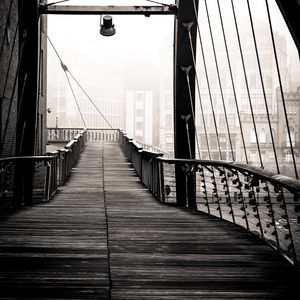 Preview wallpaper bridge, buildings, fog, black and white