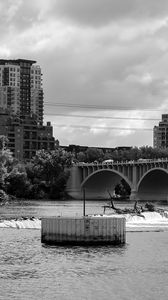 Preview wallpaper bridge, buildings, river, black and white