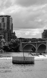 Preview wallpaper bridge, buildings, river, black and white