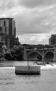 Preview wallpaper bridge, buildings, river, black and white
