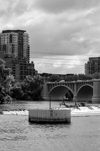 Preview wallpaper bridge, buildings, river, black and white