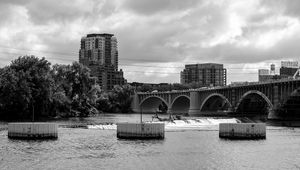 Preview wallpaper bridge, buildings, river, black and white