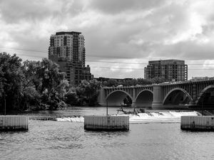 Preview wallpaper bridge, buildings, river, black and white