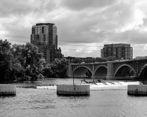 Preview wallpaper bridge, buildings, river, black and white