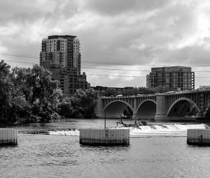 Preview wallpaper bridge, buildings, river, black and white