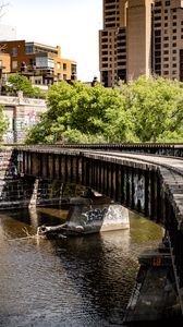 Preview wallpaper bridge, buildings, trees, river