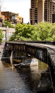 Preview wallpaper bridge, buildings, trees, river