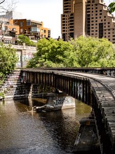 Preview wallpaper bridge, buildings, trees, river