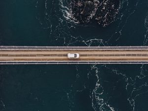 Preview wallpaper bridge, car, aerial view, water, rocks