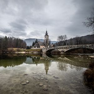 Preview wallpaper bridge, chapel, river, buildings, reflection