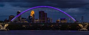 Preview wallpaper bridge, city, architecture, buildings, river, arch, clouds