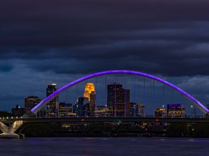 Preview wallpaper bridge, city, architecture, buildings, river, arch, clouds