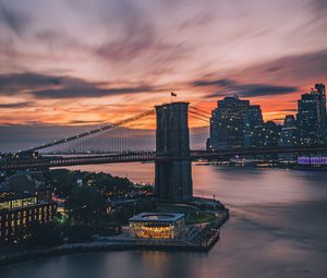 Preview wallpaper bridge, city, architecture, water, sunset