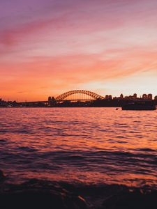 Preview wallpaper bridge, city, sunset, sea, waves